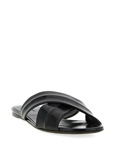 Khaite Liria Glossed-leather Sandals In Black