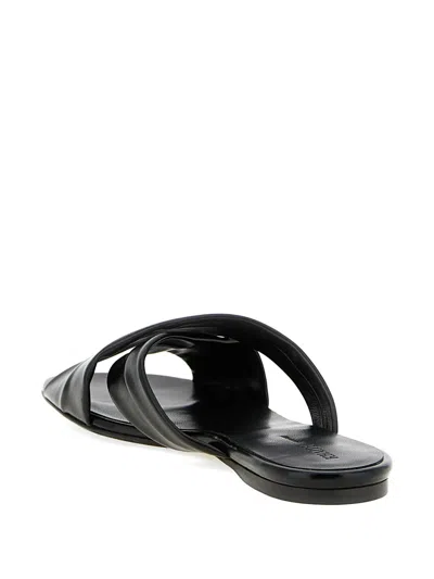 Khaite Liria Glossed-leather Sandals In Black