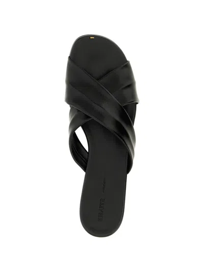 Khaite Liria Glossed-leather Sandals In Black