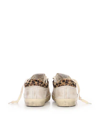 Golden Goose Super-star Sneakers In Suede With Worn Effect And Leopard Print Hairy Cow In White