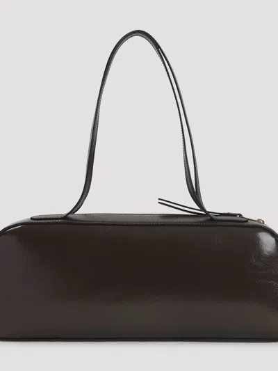 Khaite Simona Crackle Patent Elongated Tote Bag In Brown