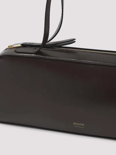 Khaite Simona Crackle Patent Elongated Tote Bag In Brown