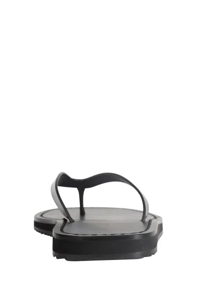 The Row Thong-strap Leather Flip Flops In Black