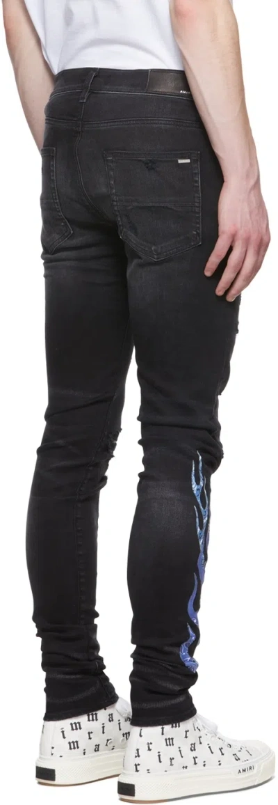 Amiri Flame-patch Jeans In Black