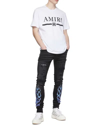 Amiri Flame-patch Jeans In Black