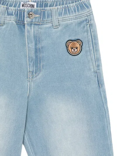 Moschino Elasticated Patch-appliqué Trousers In Blue