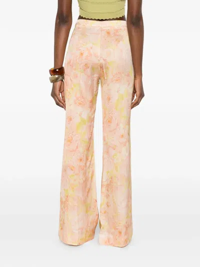 Sandro Floral-pattern Trousers In Orange