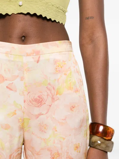 Sandro Floral-pattern Trousers In Orange