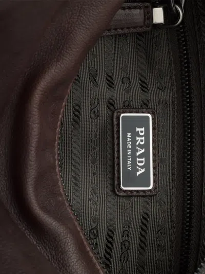 Prada Explore Leather Bag In Brown