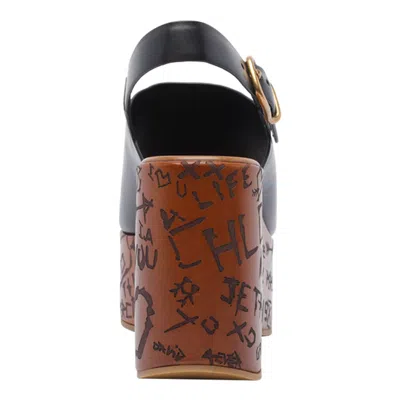 Chloé Maxime Black Wedge With Engraved Written Decorations And Logo Buckle In Leather Woman