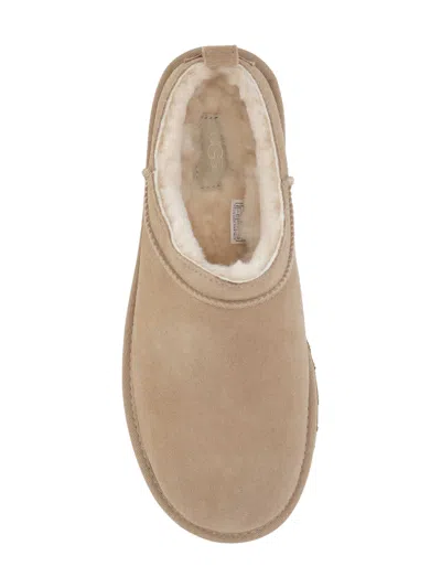 Ugg Slippers Flat Sole Pull Tab Round Toe In Sand