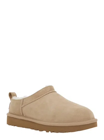 Ugg Slippers Flat Sole Pull Tab Round Toe In Sand