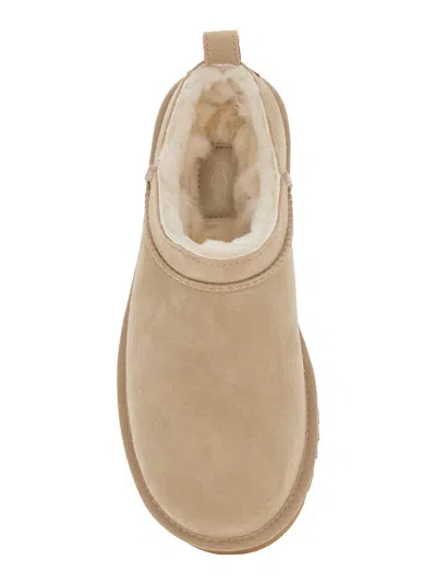 Ugg Slippers Flat Sole Pull Tab Round Toe In Sand