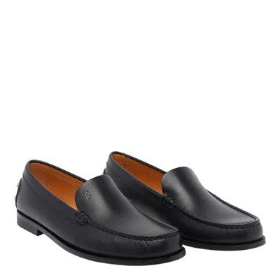 Tod's Black Loafers With Embossed Logo And Stud Details On The Back In Leather Woman