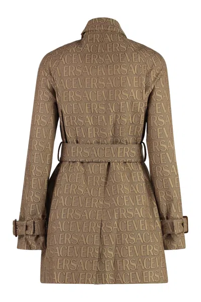 Versace Trench Coat With Allover Motif And Belted Waist In Brown