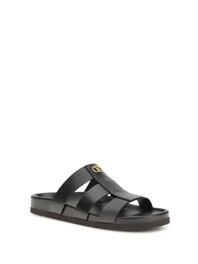 Valentino Garavani Studshield Logo-embellished Leather Sandals In Black