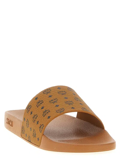 Mcm Male Monogram Print Rubber Slides In Brown