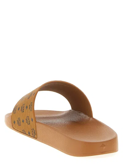 Mcm Male Monogram Print Rubber Slides In Brown