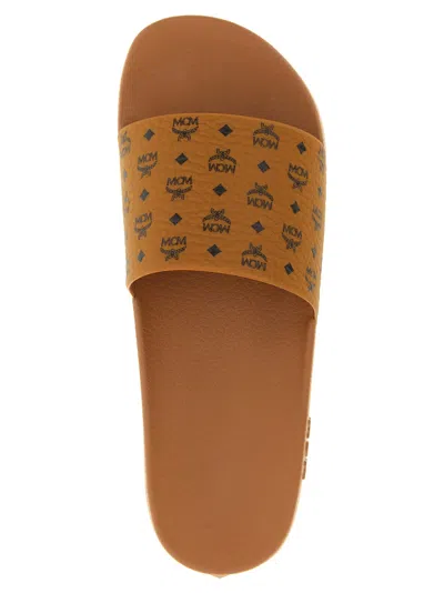 Mcm Male Monogram Print Rubber Slides In Brown