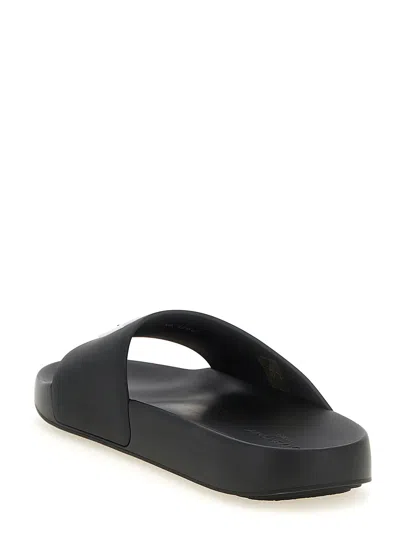 Givenchy Contoured Footbed Logo Slipper For Women In Black