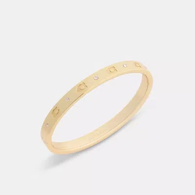 Coach Repeated C Hinged Bangle In Gold