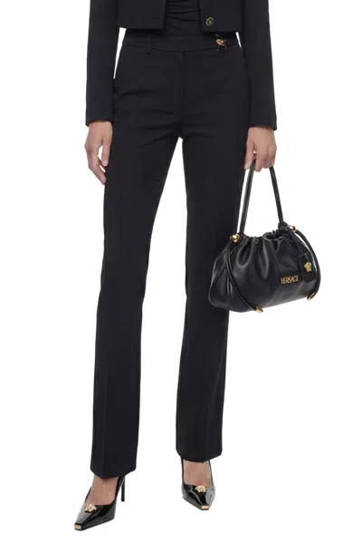 Versace Black Flared Tailored Low Waisted Pants In Stretch Wool Woman