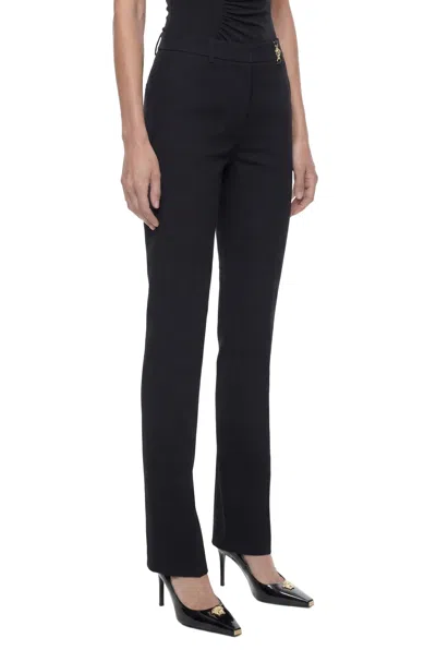 Versace Black Flared Tailored Low Waisted Pants In Stretch Wool Woman