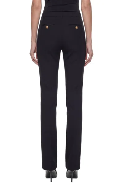 Versace Black Flared Tailored Low Waisted Pants In Stretch Wool Woman