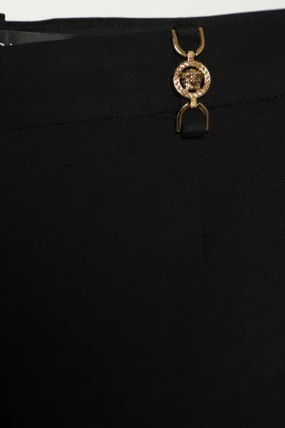 Versace Black Flared Tailored Low Waisted Pants In Stretch Wool Woman