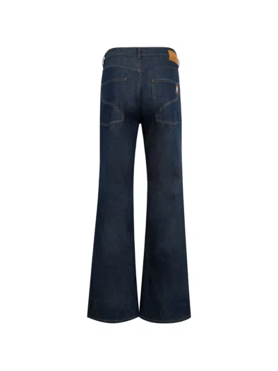 Amiri Raw Boot Cut Jeans In Blue