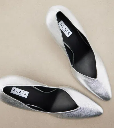 Alaïa Cone Pumps In Laminated Leather In Silver