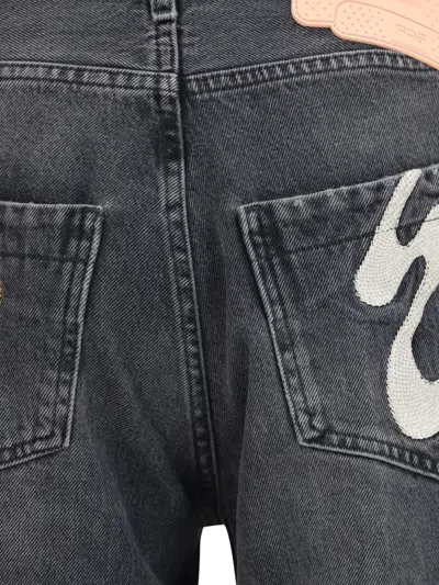 Pdf Jeans With Graphic Patches In Gray