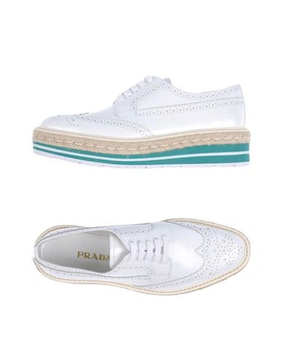 Shop Prada Laced Shoes In White
