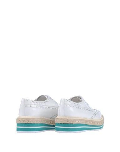 Shop Prada Laced Shoes In White