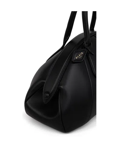 Alaïa Purse Top Handle Bag In Black