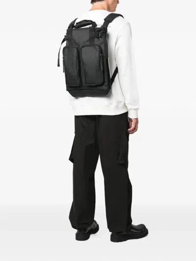 Rains Logo-print Multi-pocket Backpack In Black