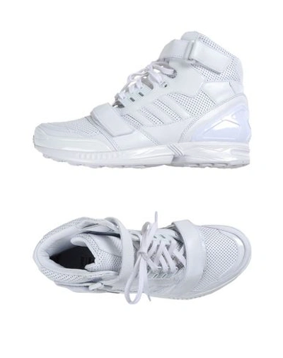 Shop Juunj Sneakers In White