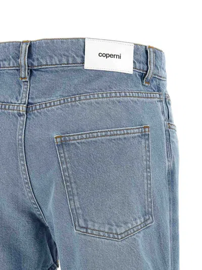 Coperni Light Blue Jeans With Cut-out Spiral Design And Logo Patch On The Rear In Denim Woman In Blue