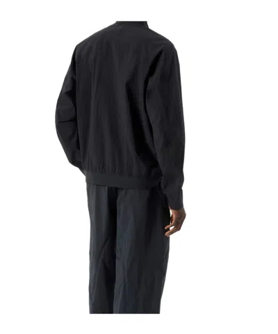 Veilance Diode Stretch Nylon Bomber Jacket In Blue