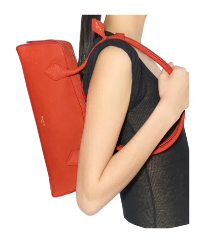 Alaïa Le Teckel Medium Nubuck Shoulder Bag In Orange