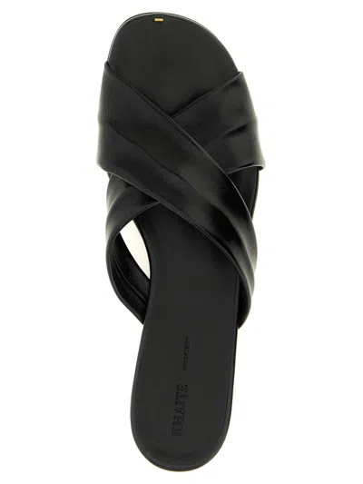 Khaite Liria Glossed-leather Sandals In Black