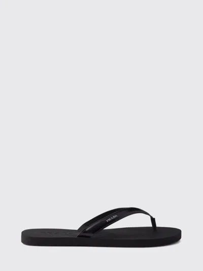 Prada Logo Embossed Leather Flip Flop Sandals In Black