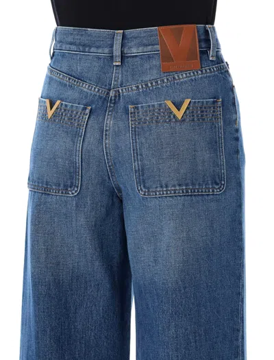 Valentino Garavani Denim Trousers With V Gold In Blue