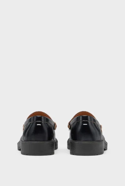 Maison Margiela Sophisticated Loafers For Men In Black