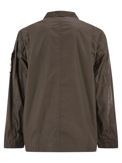 Stone Island Field Jacket With Pigmented Wax Coating In Brown
