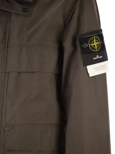 Stone Island Field Jacket With Pigmented Wax Coating In Brown