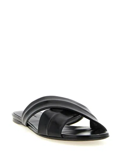 Khaite Liria Glossed-leather Sandals In Black