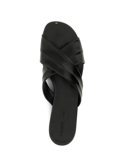 Khaite Liria Glossed-leather Sandals In Black