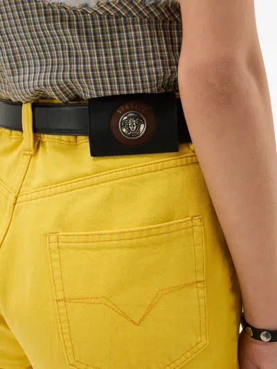 Versace Buttoned Jeans In Yellow