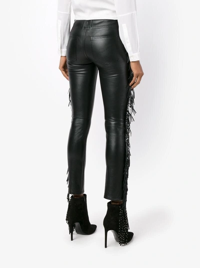 Shop Saint Laurent Fringed Leather Trousers In Black